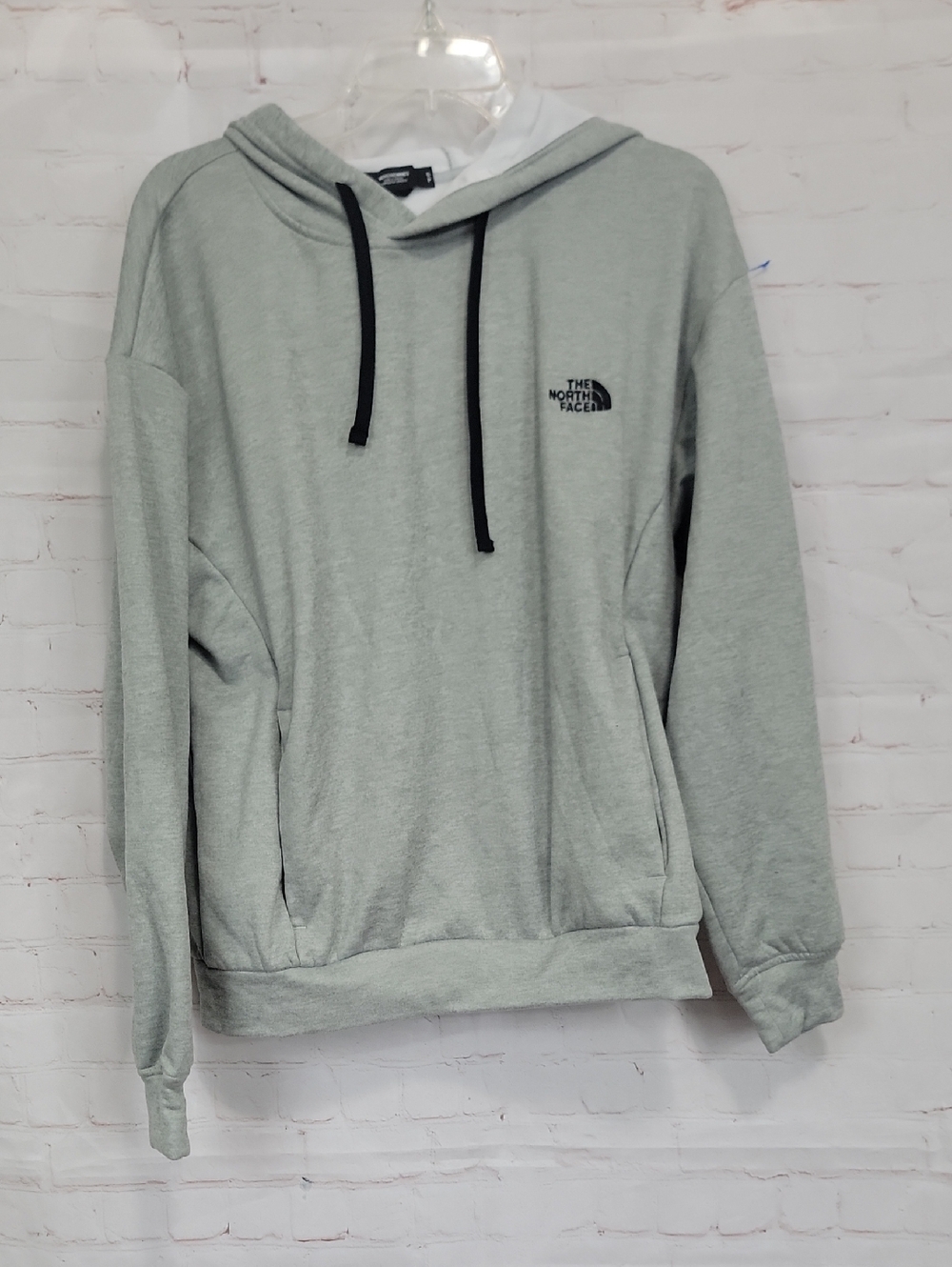 The North Face Light Gray Pullover Hoodie with Black Drawstrings